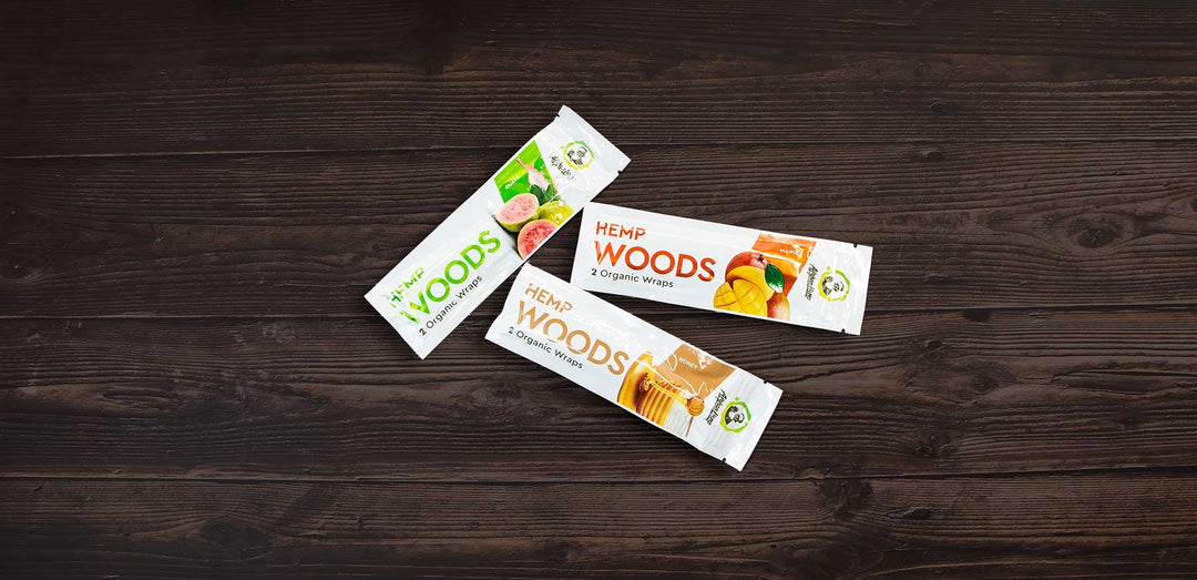 Wholesale Blunt Wraps laying down on a dark wooden table