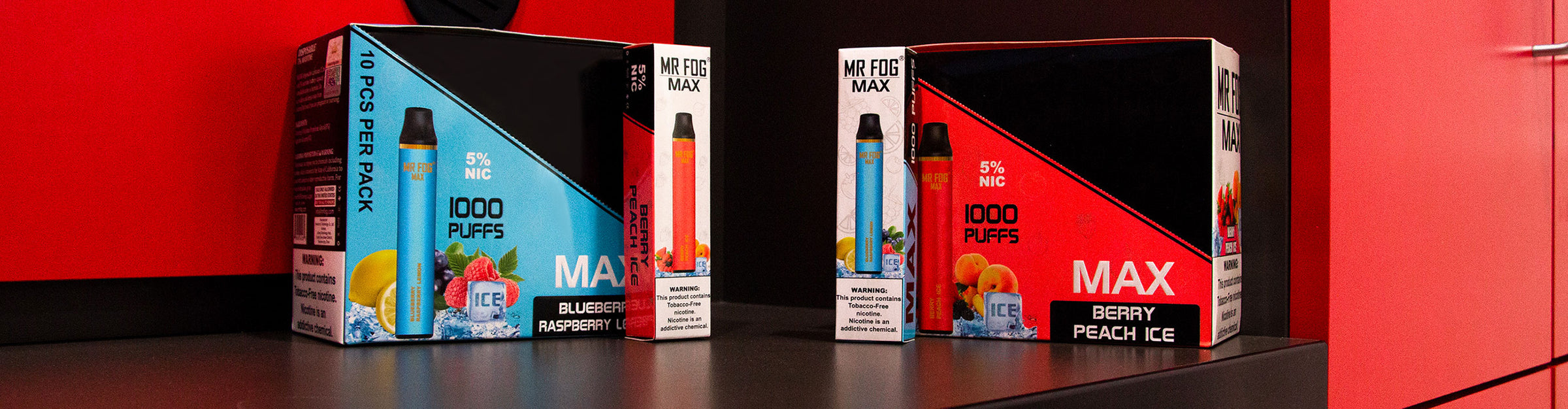 Wholesale Mr. Fog Disposables pack and singles standing on a red and black office table
