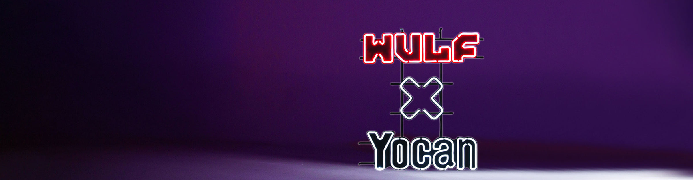 Got Vape Wholesale Wulf x Yocan Neon Sign inside studio with purple lighting