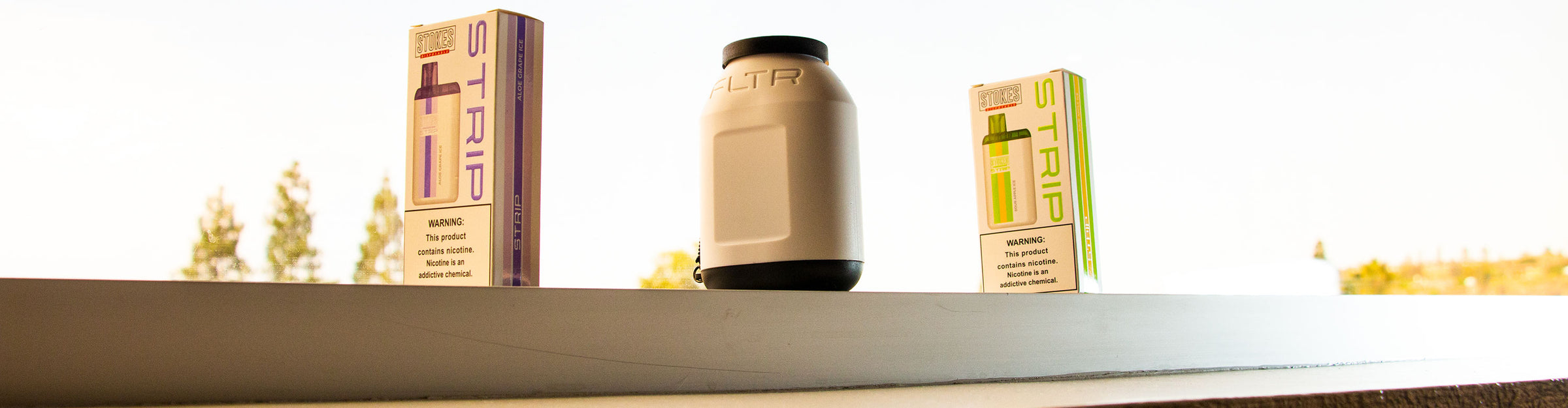 Wholesale Stokes Products standing on edge of window inside office building