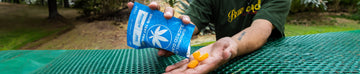 man holding Sacred EPN Gummies at park