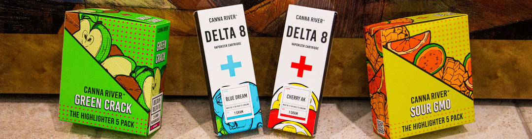 Wholesale Canna River Delta 8, Delta 10 and THC 0 5 pack of disposables with Delta 8 Cartridges resting against a portrait