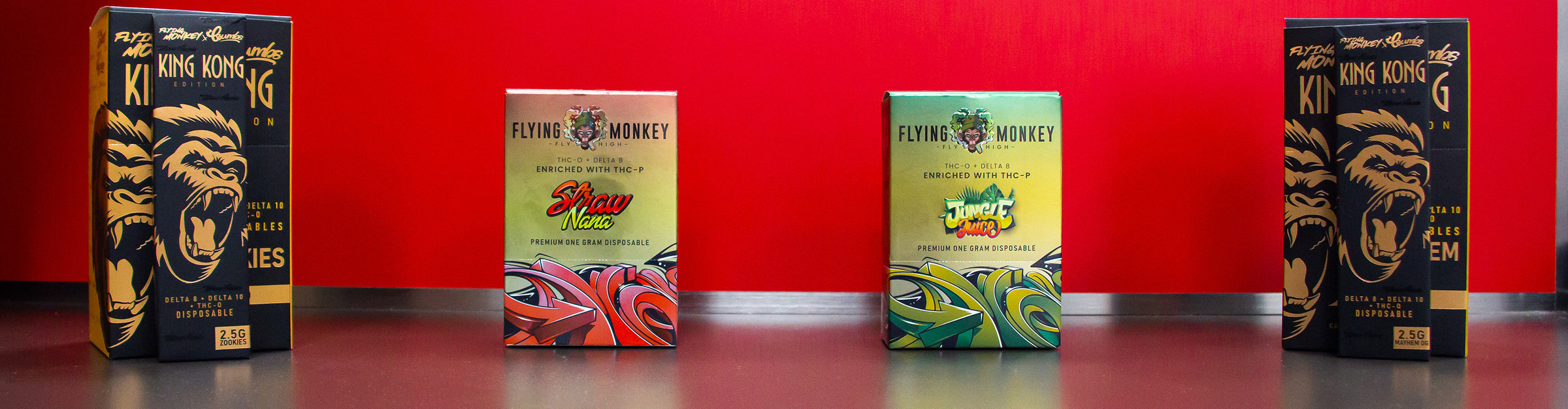 Wholesale Flying Monkey packages standing in a row on black and red desk