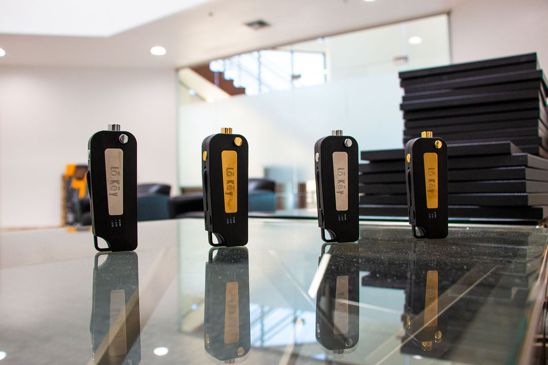 Wholesale LoKey cartridge Vaporizers standing on a glass table inside office lobby