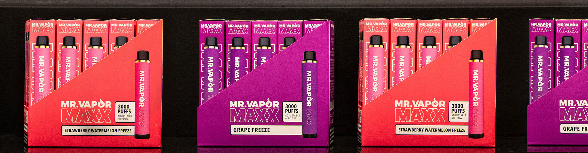 Wholesale Mr. Vapor disposable packs in a row on a black background