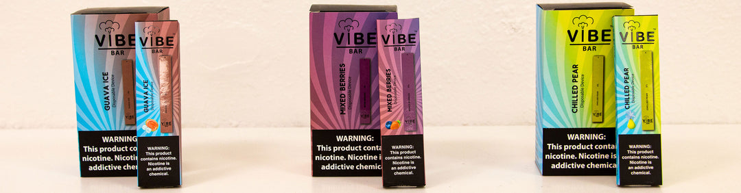 Wholesale Vibe Bar packaging and single box arranged in a row on a white background inside an office