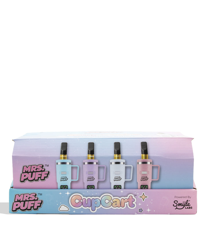 A boxed set of four vape devices displayed on a pastel gradient retail box. The devices come in light blue, lavender, white, and pink, each with a small handle and black mouthpiece.