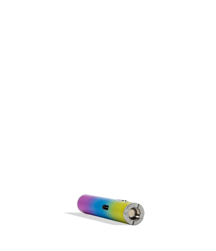 A small cylindrical electronic device with a rainbow gradient finish, lying horizontally on a plain white background.