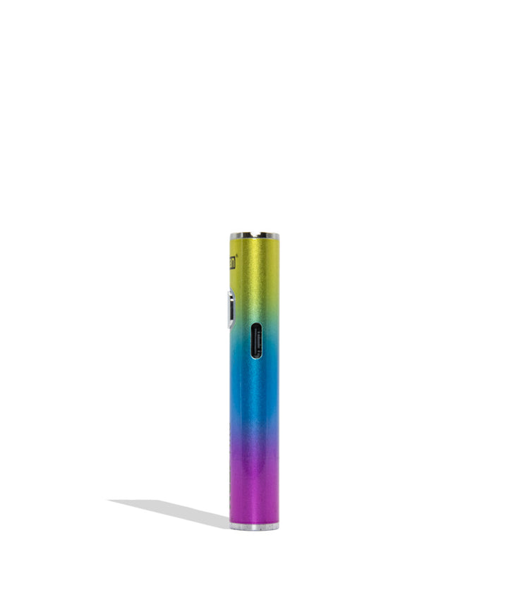 A slim cylindrical vape device 510 battery with a metallic rainbow gradient transitioning from yellow-green to blue and purple, standing upright on a white background with a soft shadow.
