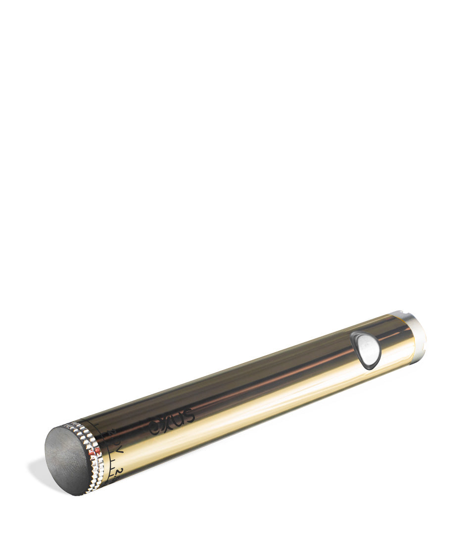 Gold laying down Exxus Vape Twistr Cartridge Vaporizer on white studio background