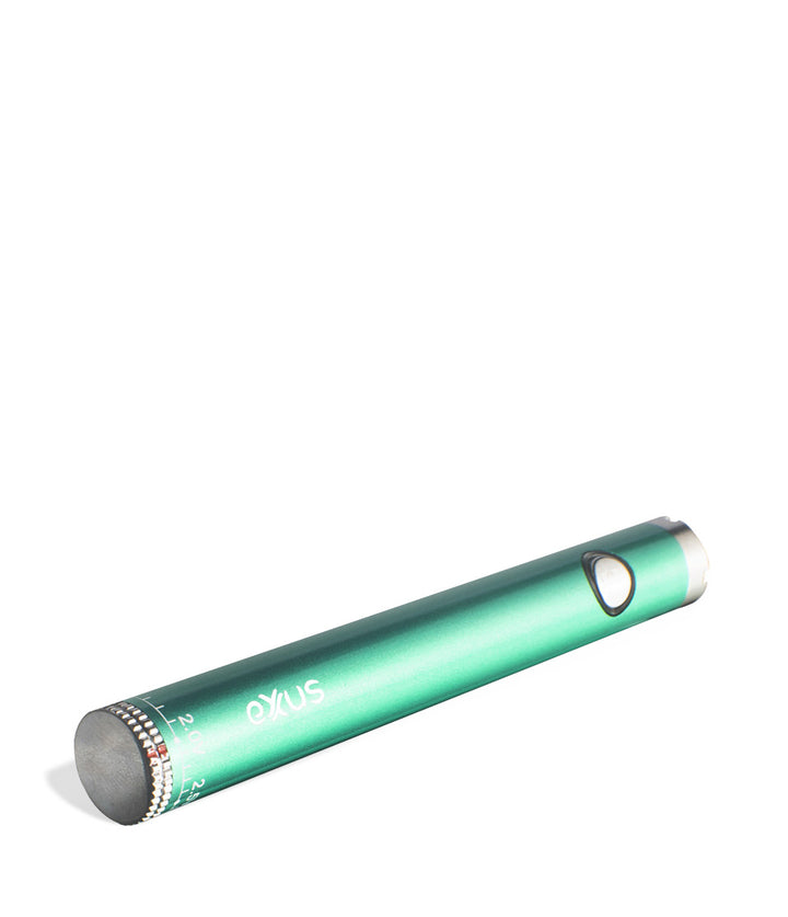 Cosmic green laying down Exxus Vape Twistr Cartridge Vaporizer on white studio background