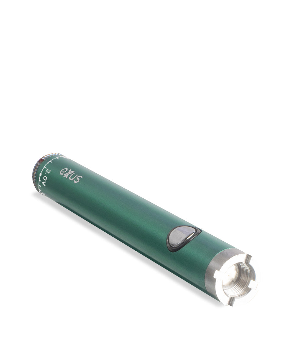 Cosmic green laying down Exxus Vape Twistr Cartridge Vaporizer on white studio background