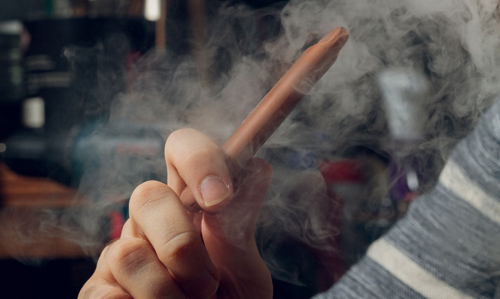 Man vaping CBD disposable