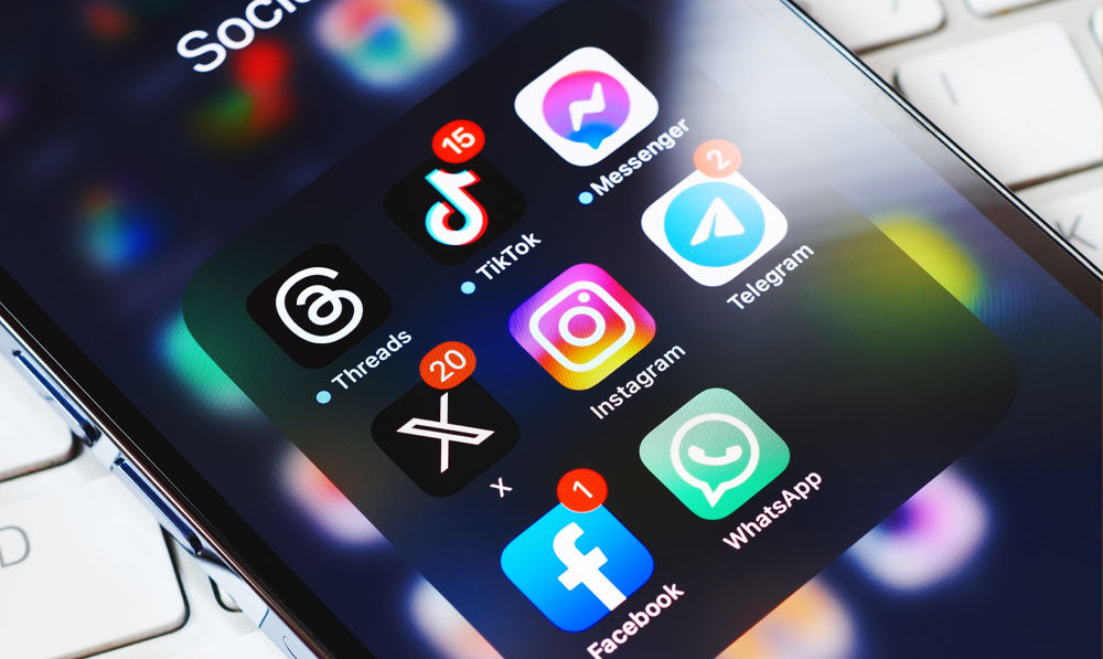 Unlocked iPhone with social media folder opened and icons on the screen