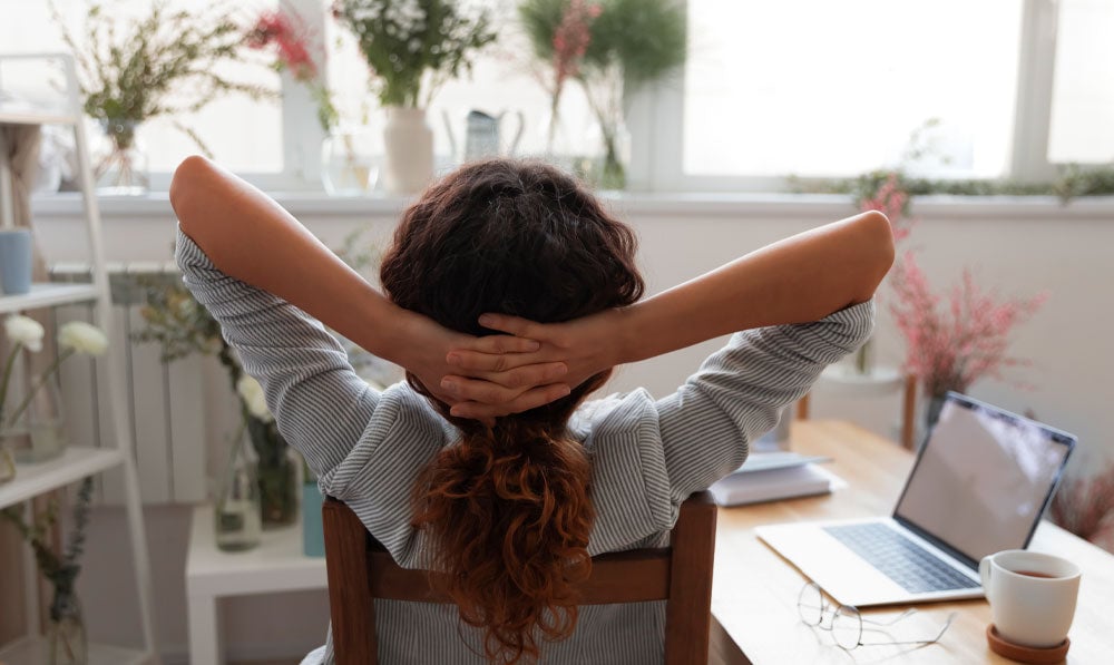 Woman lying back in a chair when all is well done