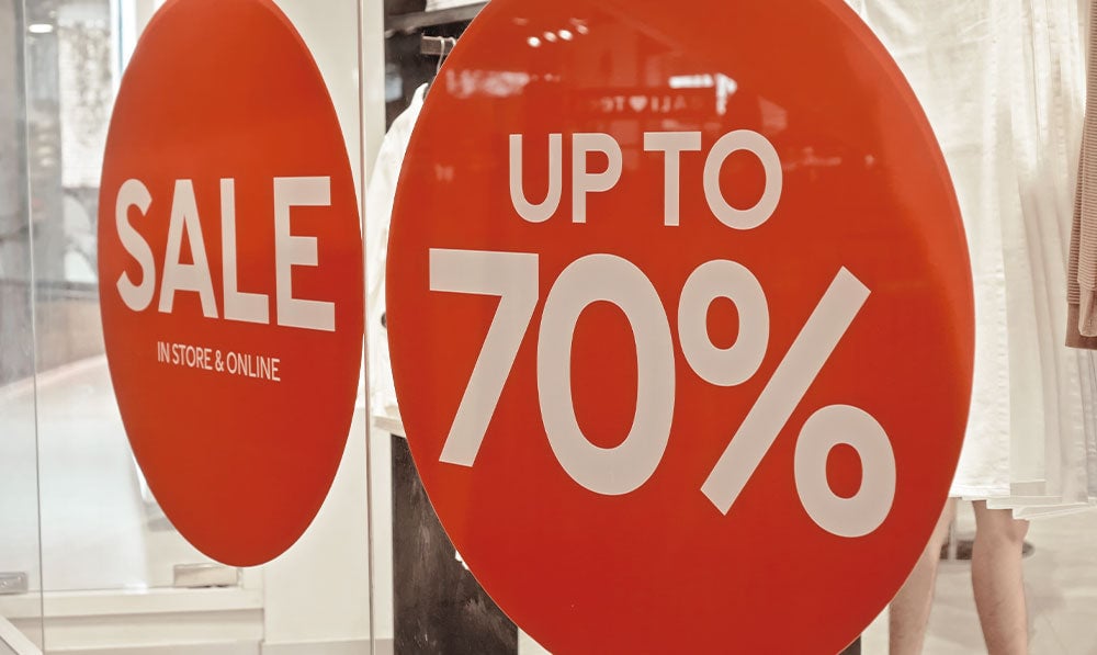 70% sale sign inside store