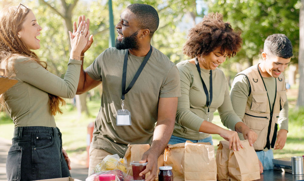 Volunteers participating in a food charity at a park