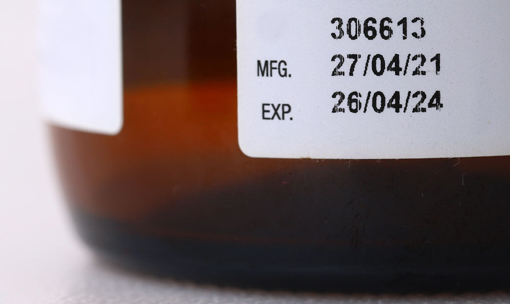 Closeup of an expiration date on a bottle
