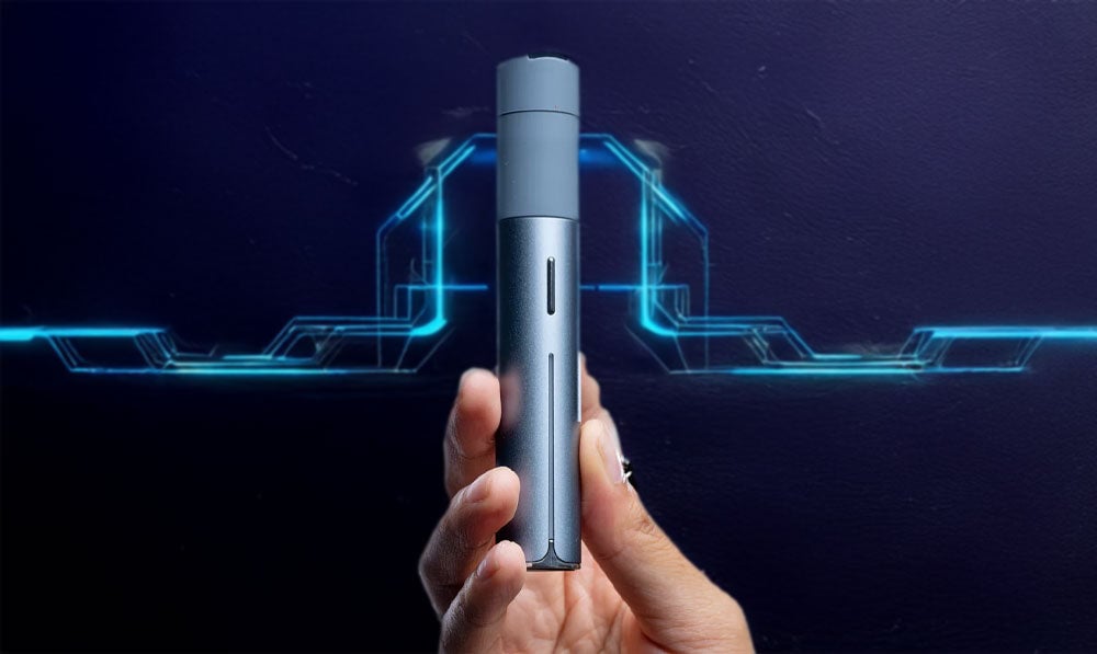 Person holding Puffco Pivot in front of futuristic art background