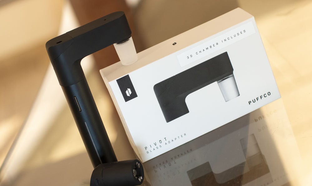 Puffco Pivot Glass Adapter on reflective glass surface