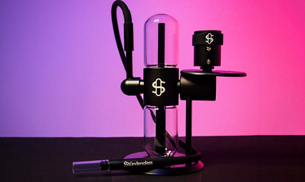 Stundenglass Gravity Infuser in front of purple studio background