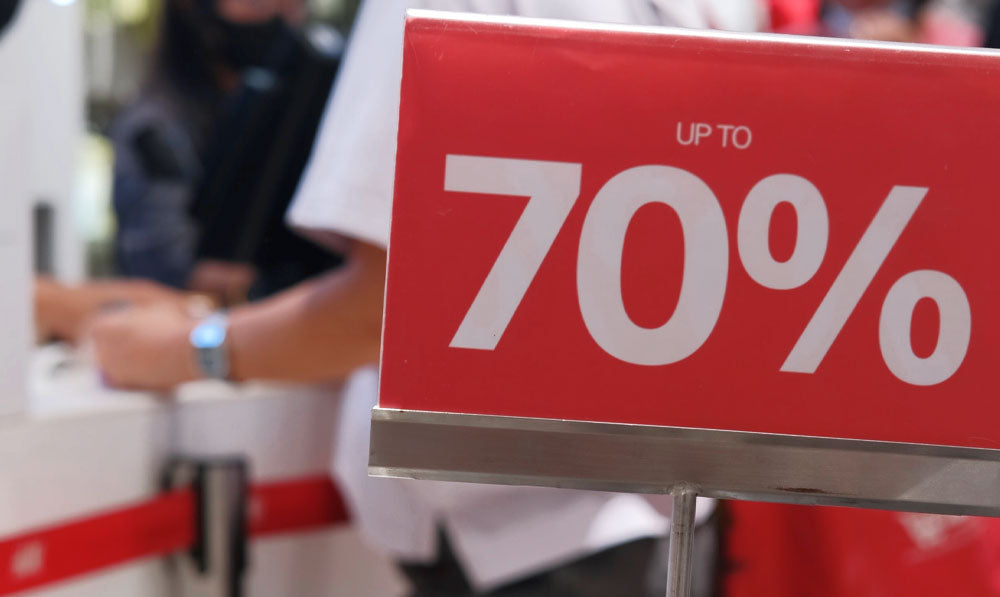 Up to 70% Off Sale sign near cash register
