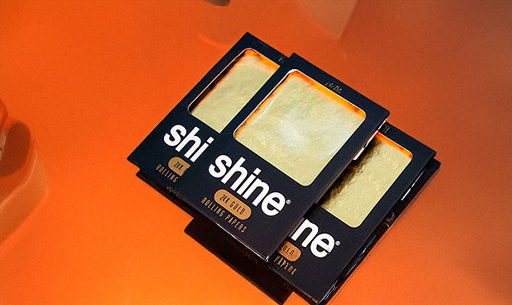 Shine Rolling Papers on orange surface