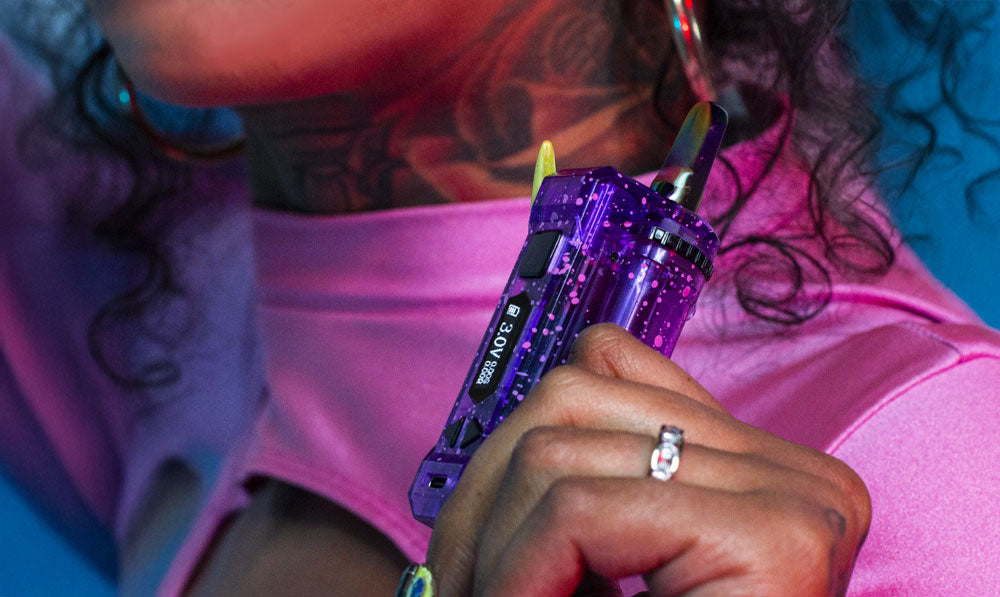 Woman holding Wulf X-Ray UNI Pro in front of blue studio background