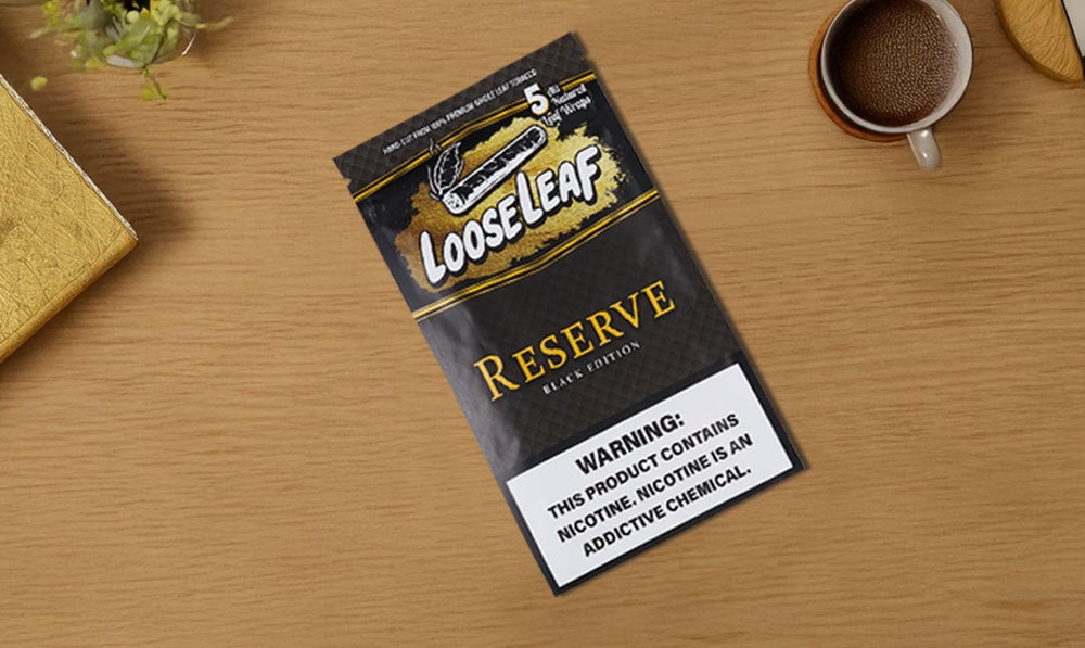 Loose Leaf Blunt Wraps laying on desk inside home