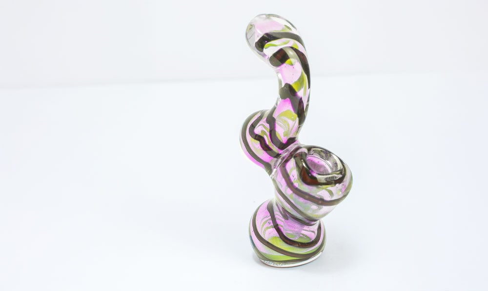 Glass bubbler on white surface