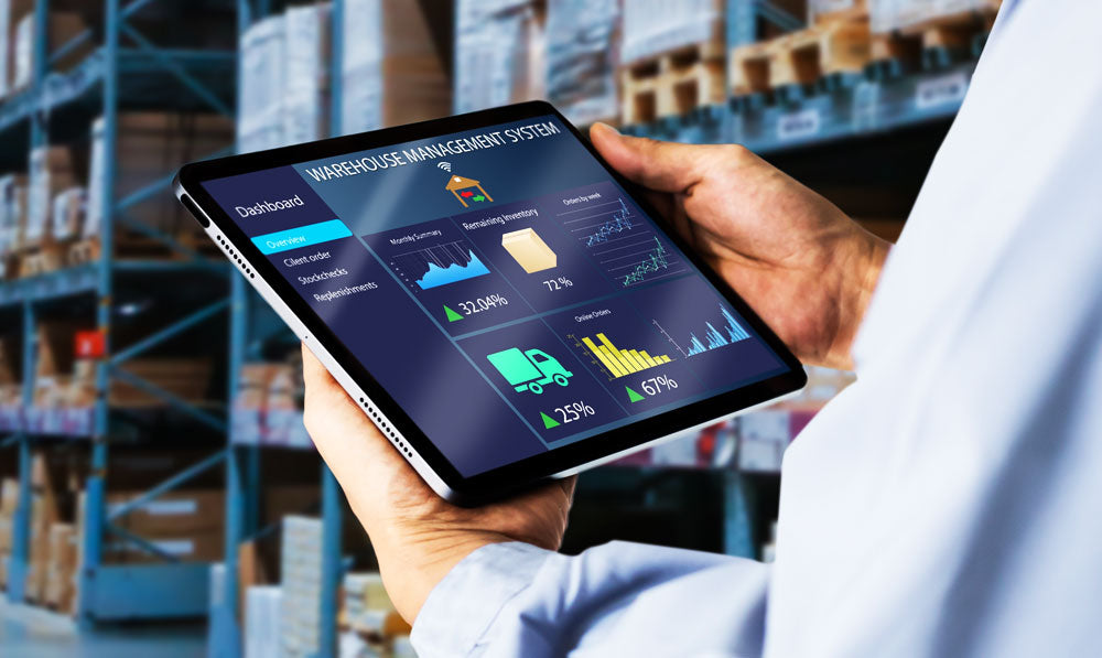 Person in warehouse using tablet system