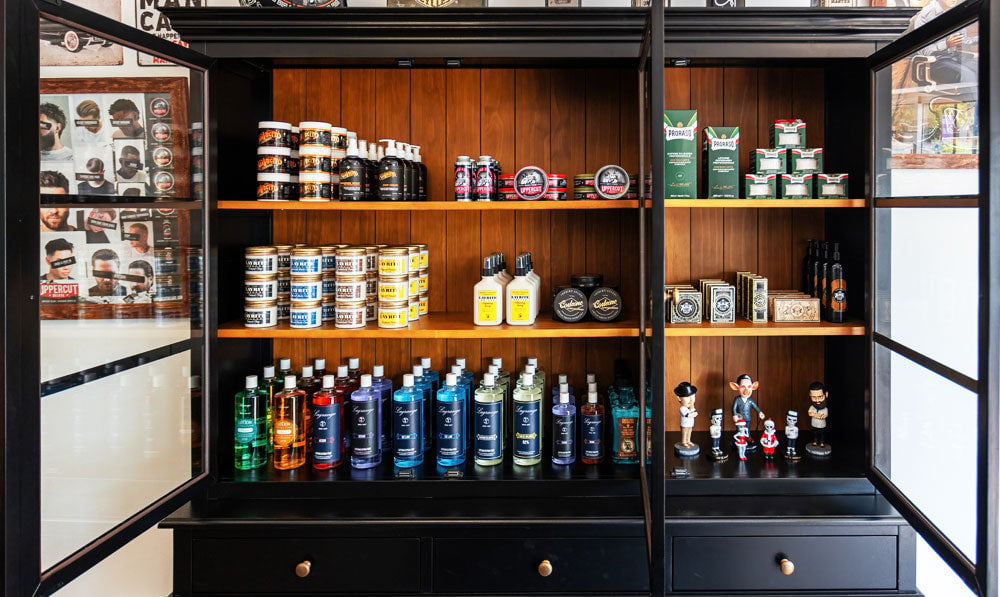 Wooden shop display cabinet open in front of a wall