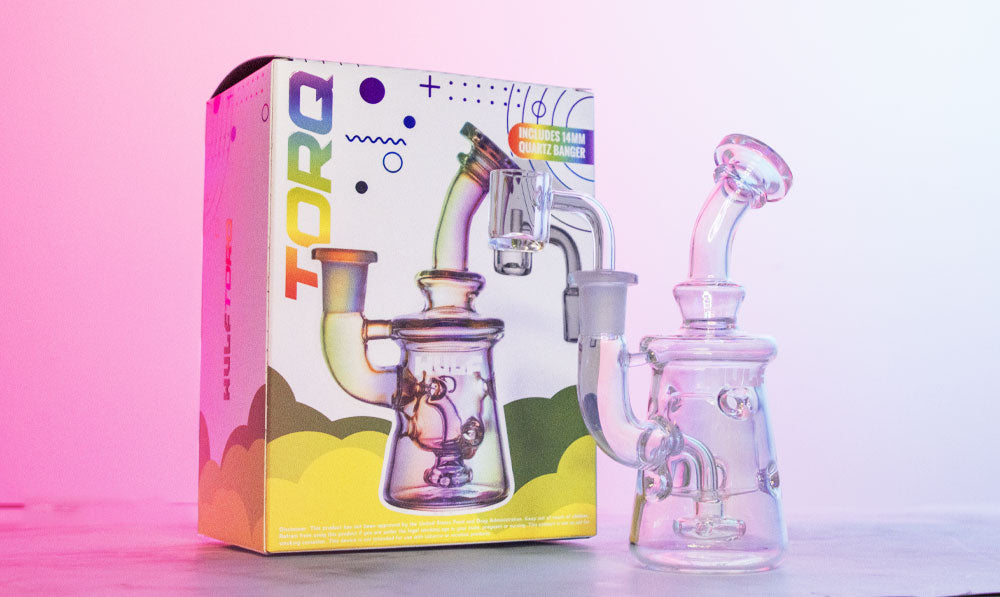 Closeup of Wulf Torq on white surface with packaging and colorful lighting