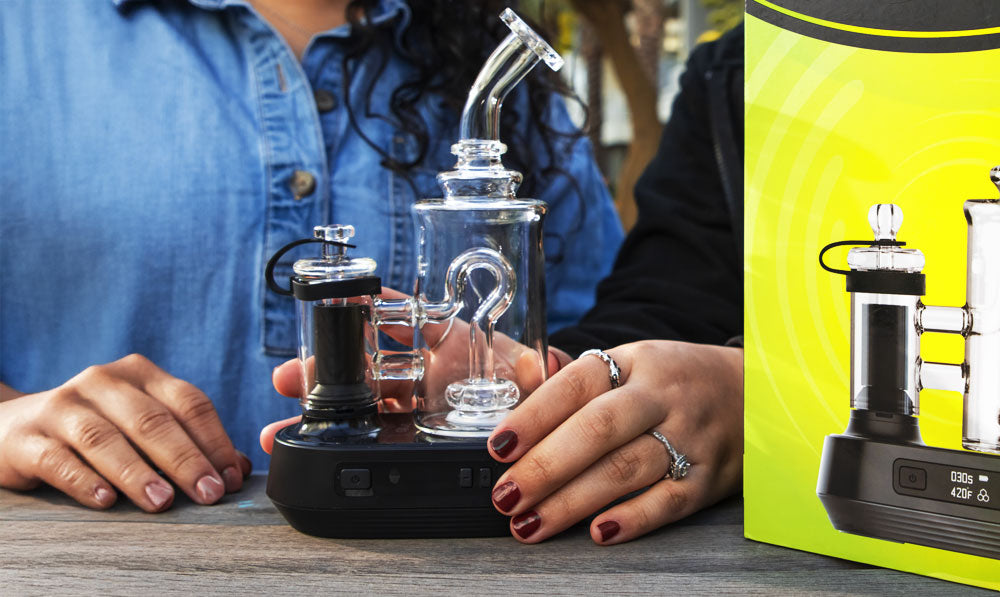 Women with Exxus Go Plus on park bench with packaging nearby