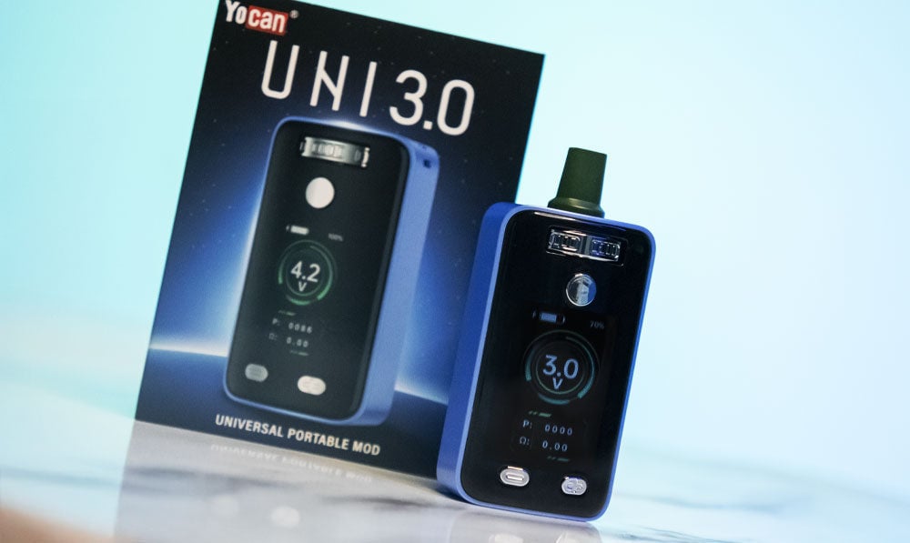 Yocan UNI 3 on marble surface background in front of blue lighting