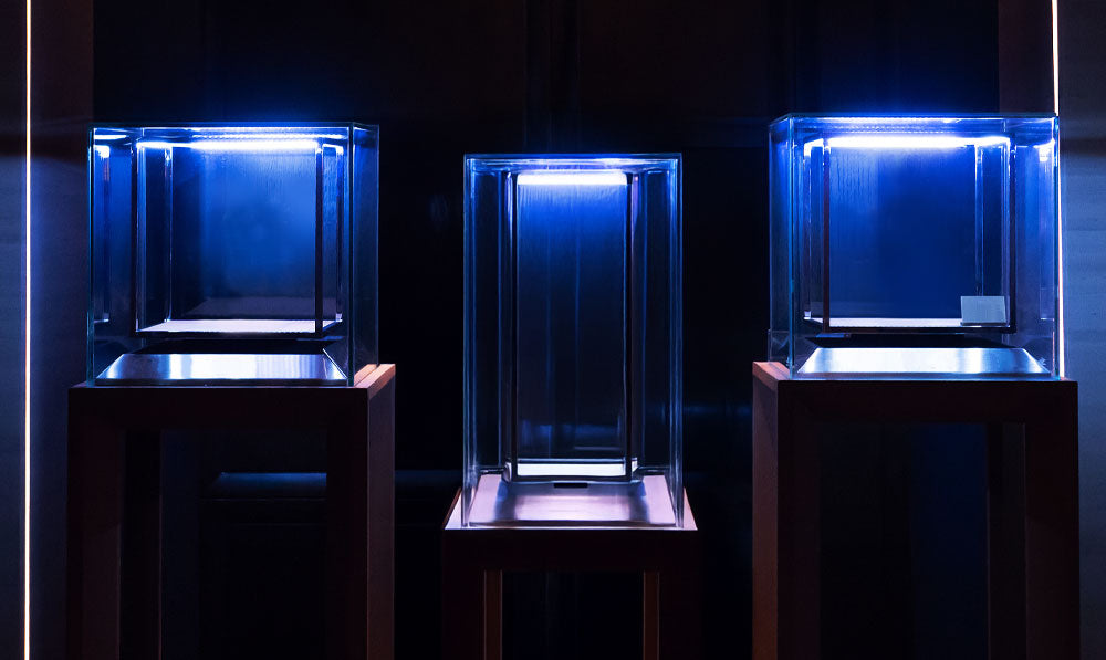 Clear Glass Box Displays On Wooden Platform