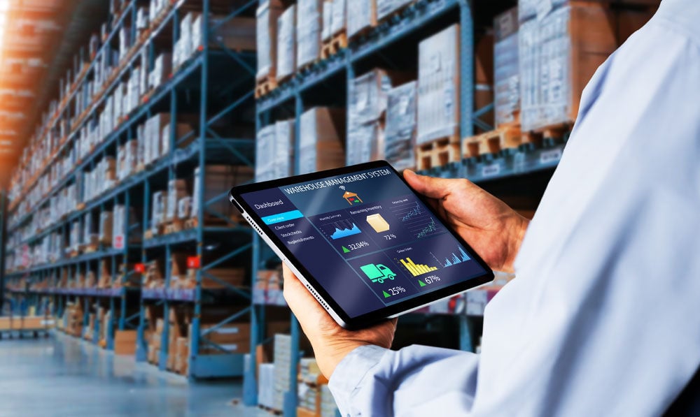 Employee reviewing back stock in the warehouse