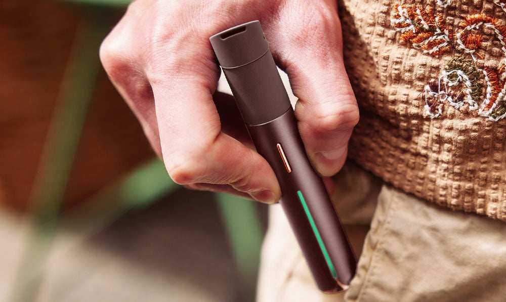 Man pulling Puffco Pivot Mocha out of pocket