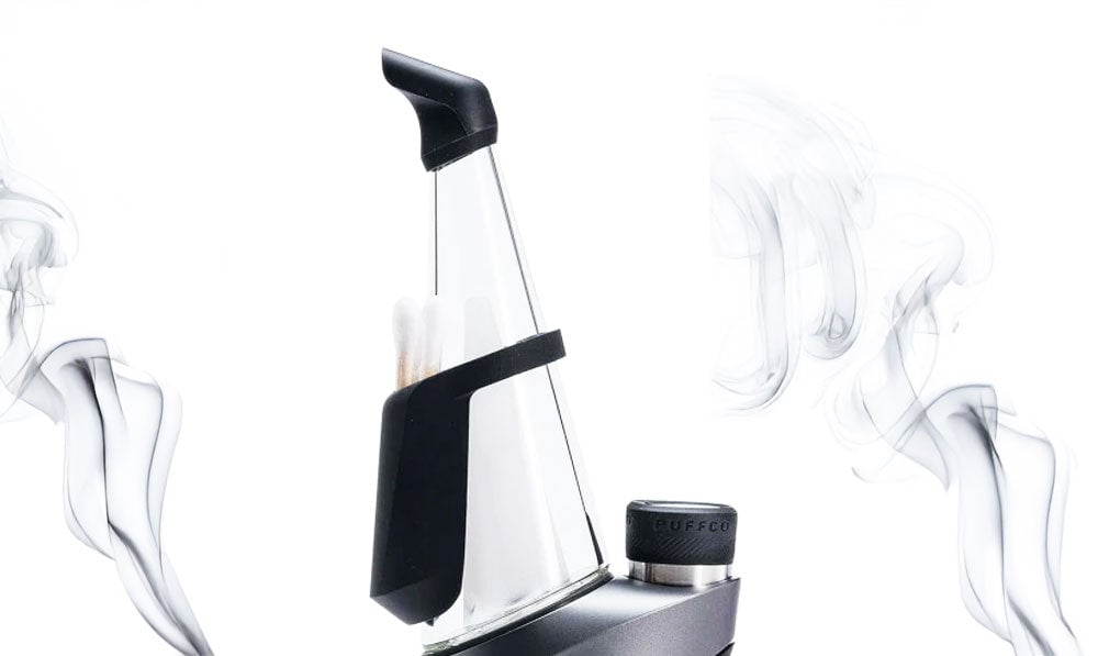 Puffco Peak Pro Travel Pack v2 on white background with smoke clouds swirling
