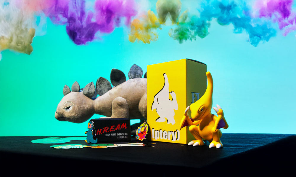 Elbo collection of products on dark surface in front of teal studio background