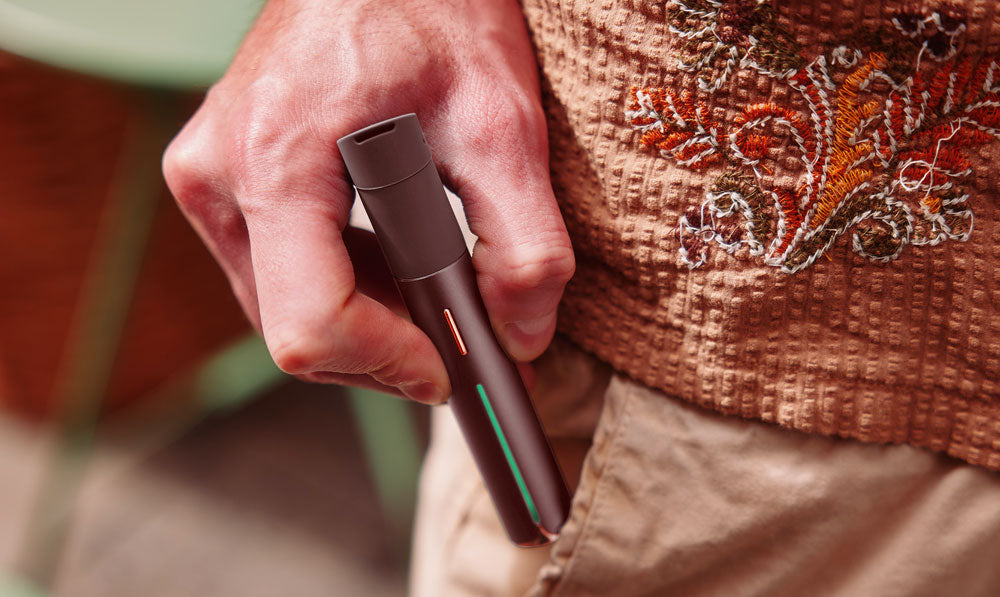 Man pulling Puffco Pivot Mocha out of pocket