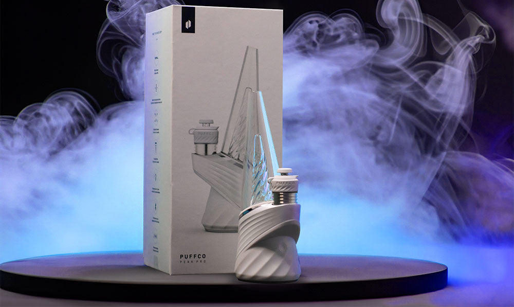 Puffco Peak Pro 3DXL on black platform with neon lights