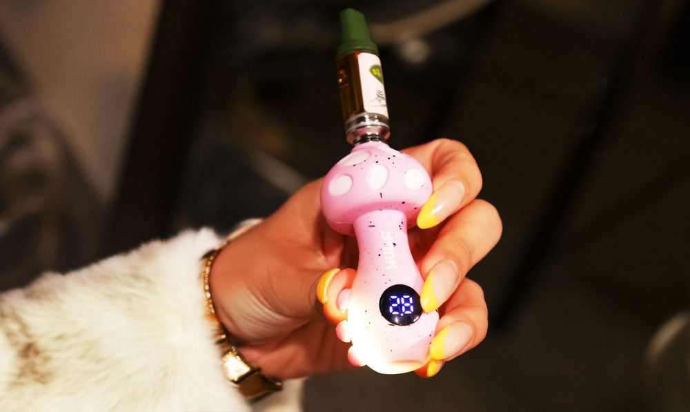 woman holding Wulf Tryp Variable Voltage Battery
