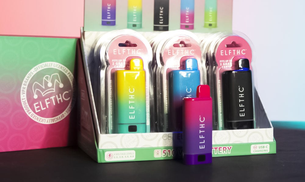 Elf THC Box Concealer standing on dark surface with packaging and pink and blue lighting