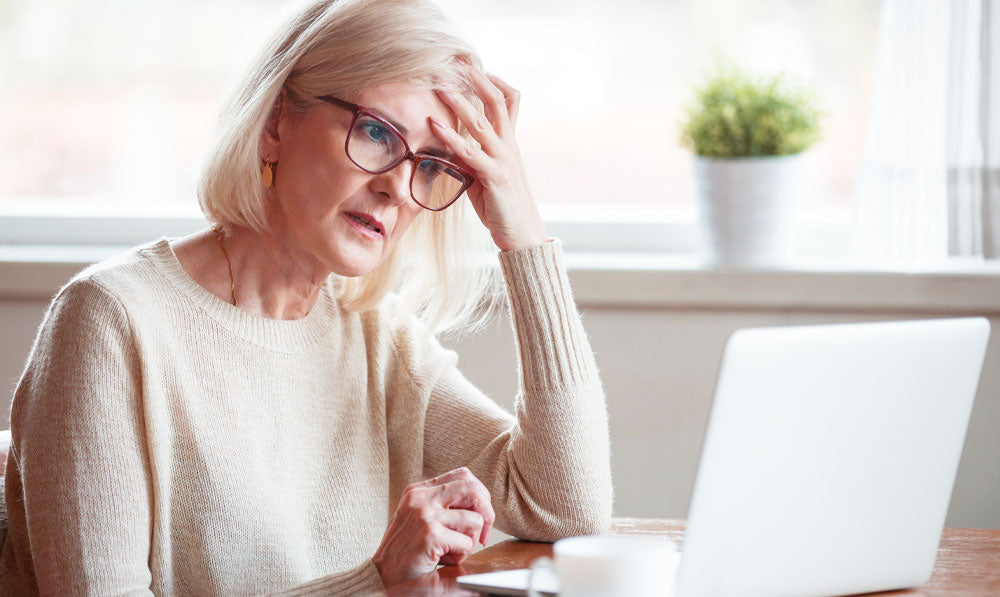 Confused Older Customer Staring At Computer