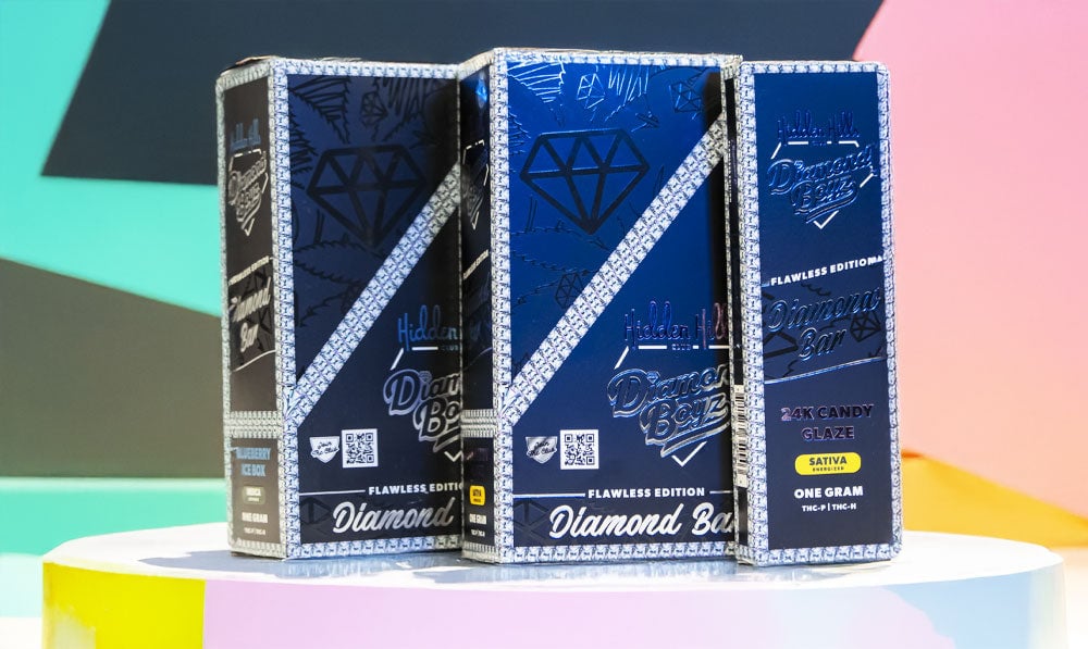 Hidden Hills Diamond Boyz Diamond Bar Disposables on colorful platform with pastel background