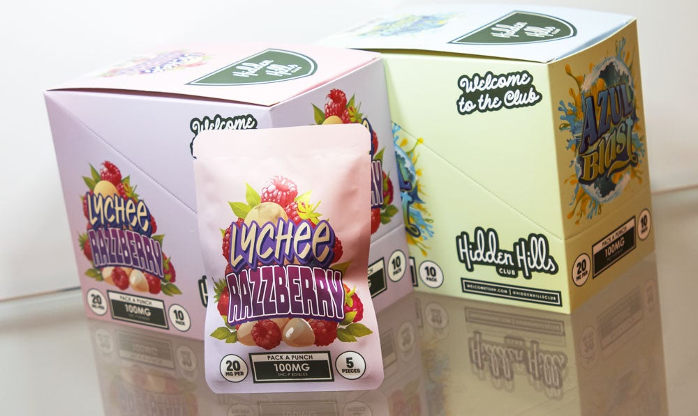 Hidden Hills Pack-a-Punch gummies on reflective glass display