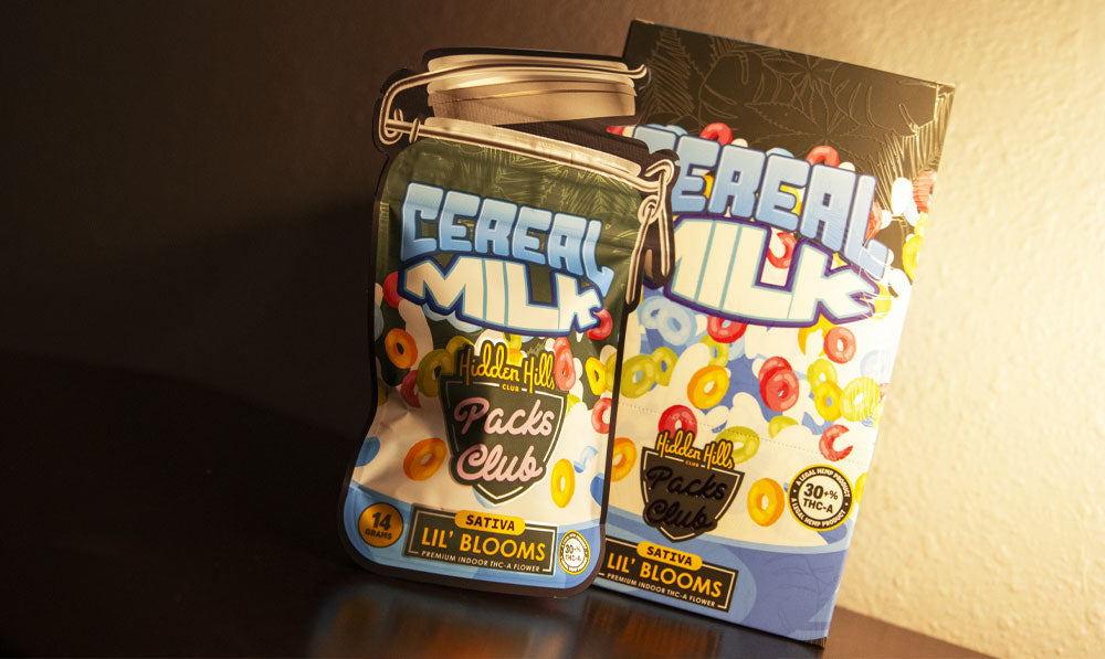 Cereal Milk Hidden Hills THC-A Flower on dark platform with bright lighting