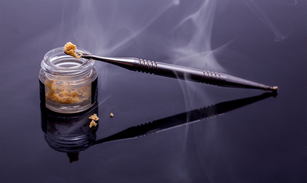 dab tool with concentrate on black background