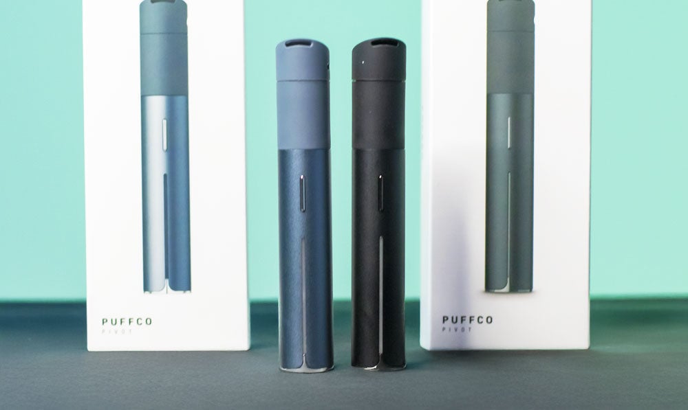Puffco Pivot standing with packaging on display platform